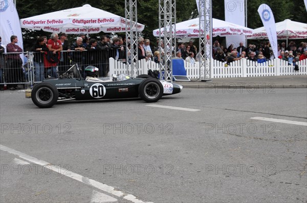 A classic black formula racing car with number 60 surrounded by spectators, SOLITUDE REVIVAL 2011,