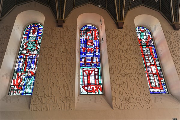 Speyer Cathedral, Colourful stained glass windows next to a wall with relief-like lettering, Speyer