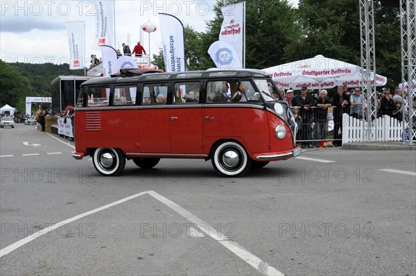 VW Samba Bus, built in 1953, side view of a classic red VW bus at an event, SOLITUDE REVIVAL 2011,