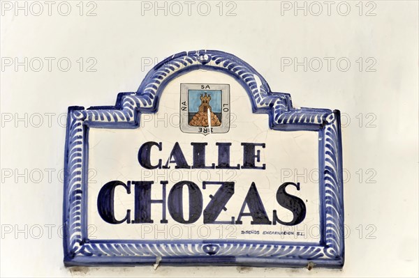 Solabrena, A traditional blue and white ceramic sign shows the street name 'Calle Chozas',
