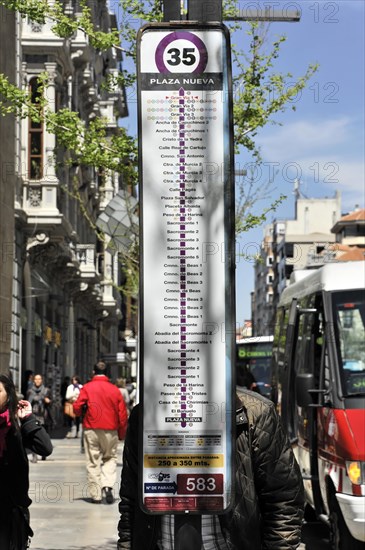 Granada, bus stop sign with the number 35 and a list of bus stops in an urban context, Granada,
