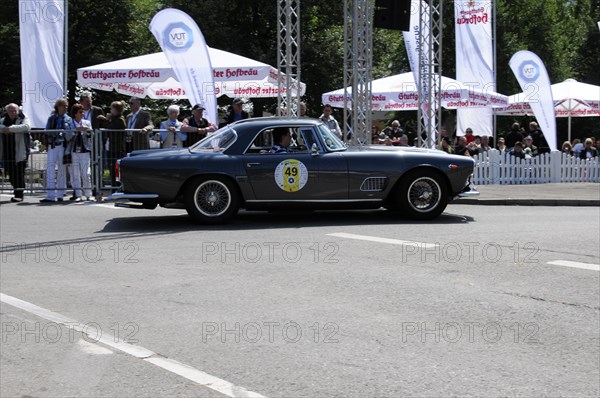 A dark blue Lancia vintage coupe on a race track in front of an audience, SOLITUDE REVIVAL 2011,