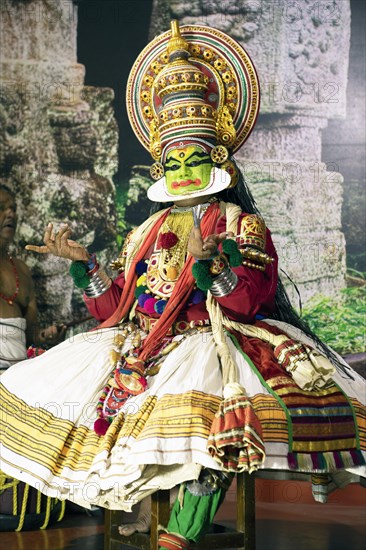 Kathakali performer or mime, 38 years old, on stage at the Kochi Kathakali Centre, Kochi, Kerala,