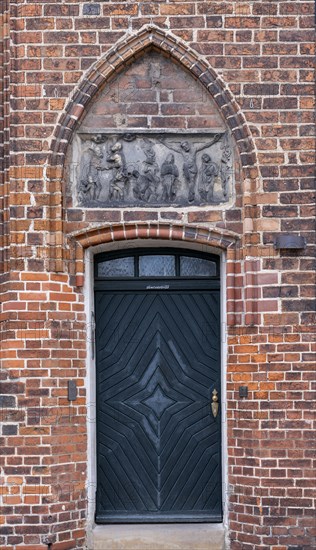 Relief with crucified Christ above a door of the parish church of St Laurentius, Havelberg,