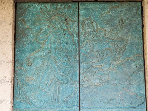 Church door with religious motifs, abbey church Santissima Trinita di Saccargia of the destroyed