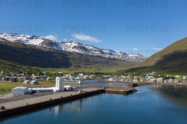 View over harbour and town Seyoisfjoerour along the fjord Seydisfjoerdur in summer, Eastern Region,