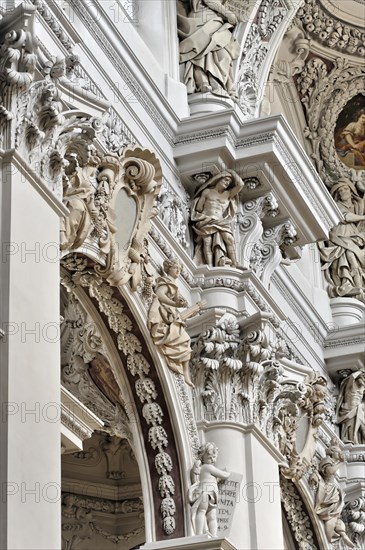 St Stephen's Cathedral, Passau, detail of baroque stucco work with sculptures in a church interior,