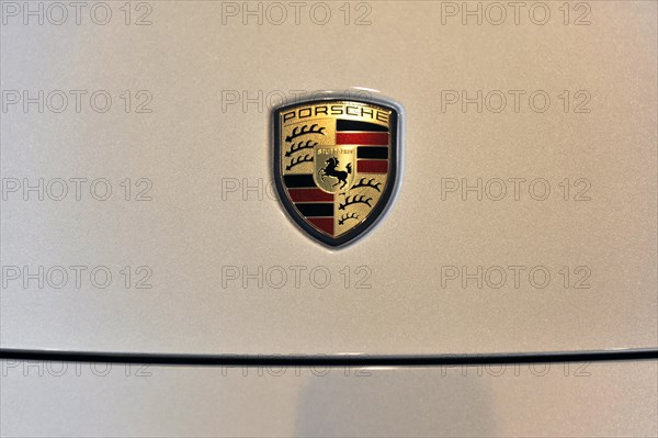 Close-up of the metallic Porsche emblem on a car, Schwaebisch Gmuend, Baden-Wuerttemberg, Germany,