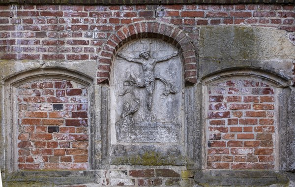 Stone relief of the crucified Christ at St Mary's Cathedral, Havelberg, Saxony-Anhalt, Germany,