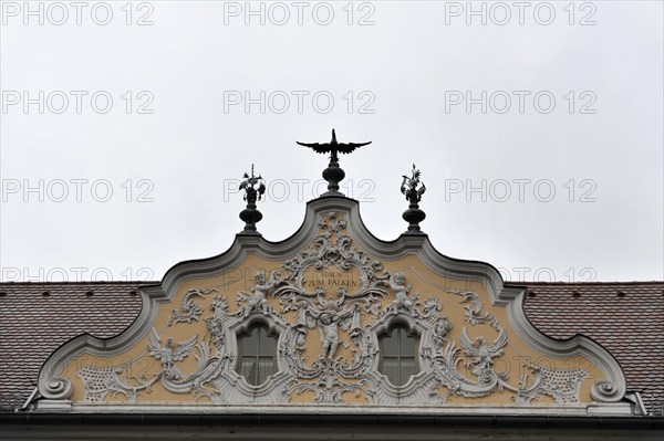 Facade view of the Falkenhaus with stucco facade in rococo style in the centre of Wuerzburg,