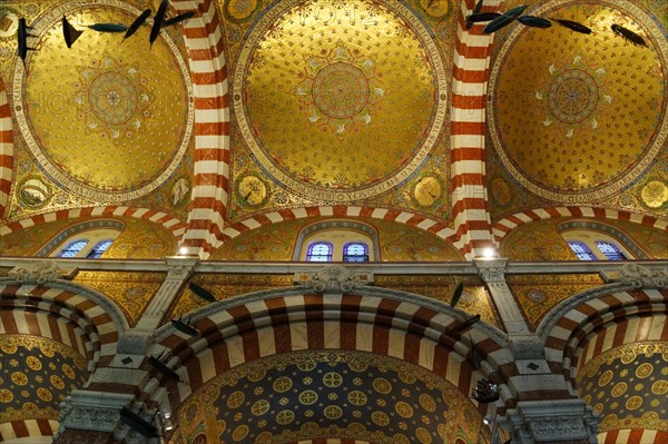 Church of Notre-Dame de la Garde, Marseille, Golden dome inside a church with mosaics and patterns,