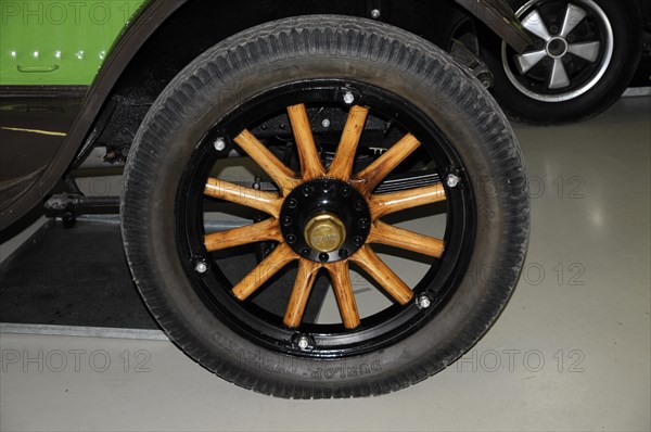 Deutsches Automuseum Langenburg, Close-up of a classic black car tyre with wooden spokes, Deutsches