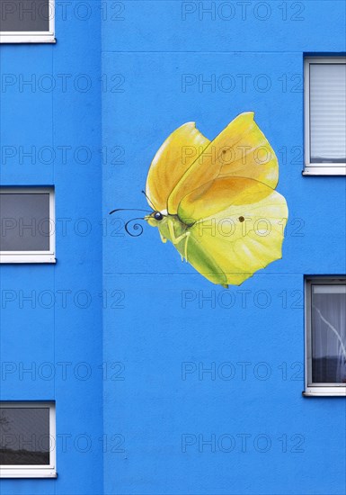 Sunflower house, painted yellow lemon butterfly on a skyscraper, artist Ulrich Allgaier, Wuppertal,