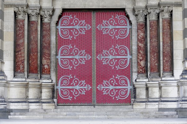Marseille, Large red door with elaborate decorations on a historic building, Marseille, Departement