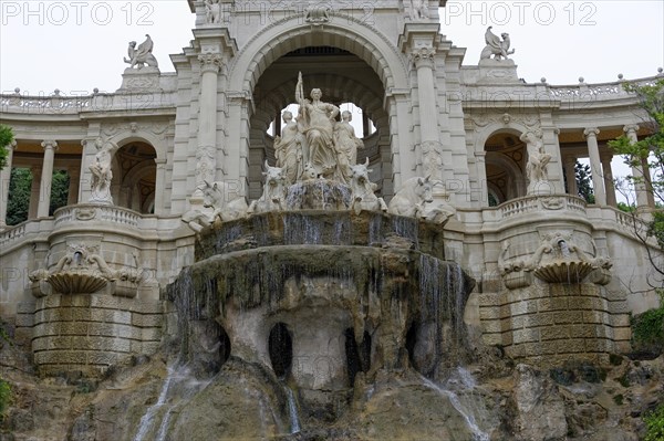Palais Longchamp, Marseille, Majestic fountain with sculptures and floral archway, Marseille,