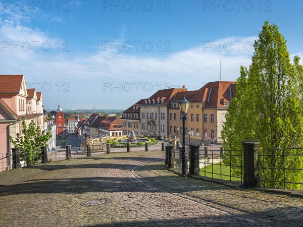 Cobbled street leading from Friedenstein Castle to the historic old town with the main market