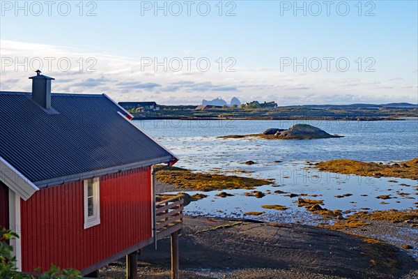 Red building with balcony by the water, Rorbuer, holiday, accommodation, Lovund, Lovunden,