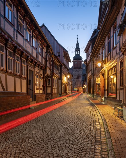 Niedergasse with Saigerturm at dusk, half-timbered houses and cobblestones, Stolberg im Harz,