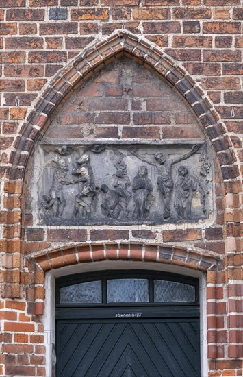Relief with crucified Christ above a door of the parish church of St Laurentius, Havelberg,