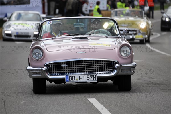 A pink Ford Thunderbird Cabriolet classic car takes part in a road race, SOLITUDE REVIVAL 2011,