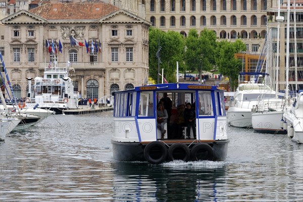 Marseille harbour, A small ferry with passengers crosses the harbour water, Marseille, Departement