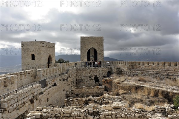 Castillo de Santa Catalina on Jaen, Historic fortress with towers and visitors on the ruins with