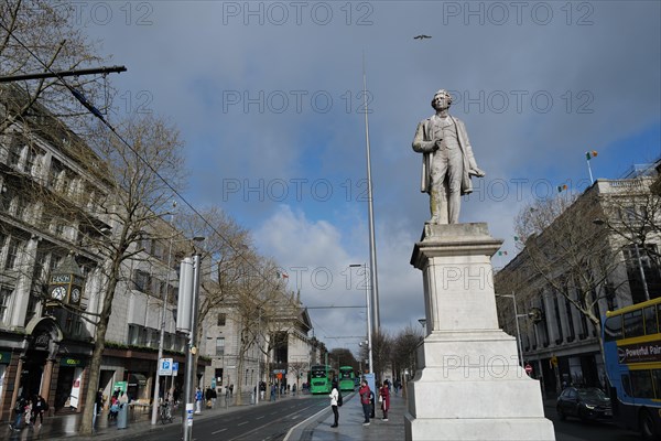 The Sir John Gray monument in O'Connell Street with the Spire in the background. Dublin, Ireland,