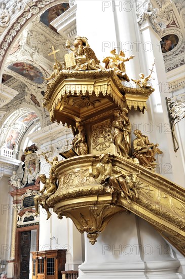 St Stephen's Cathedral, Passau, Golden baroque pulpit with angel sculptures and rich decorations,