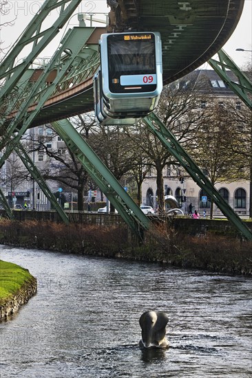 Suspension railway and sculpture by Bernd Bergkemper in the river Wupper commemorating the jump of