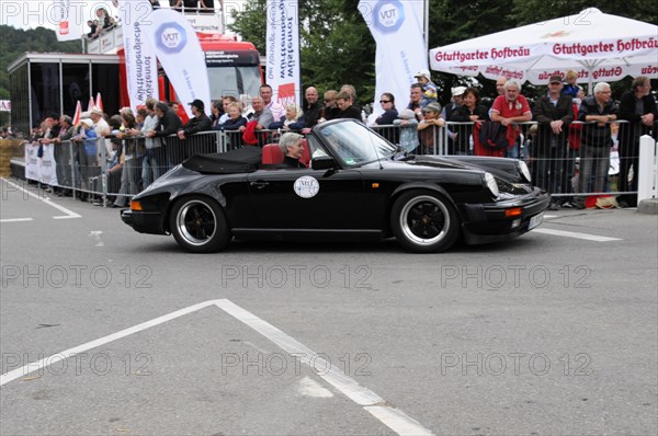 Black Porsche 911 from the side at an event with an audience, SOLITUDE REVIVAL 2011, Stuttgart,