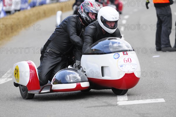 Racer on motorbike with sidecar concentrates on the race, SOLITUDE REVIVAL 2011, Stuttgart,