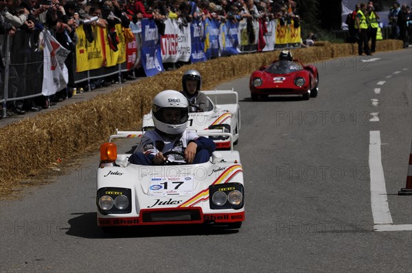 Soapbox race with two attentive drivers in white vehicles and enthusiastic spectators, SOLITUDE
