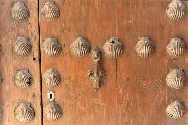 Alhambra, Granada, Andalusia, Old wooden door with shell decorations and traditional knocker,