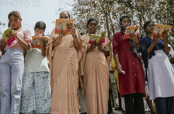 Christian devotees takes part in a perform to re-enactment of the crucifixion of Jesus Christ