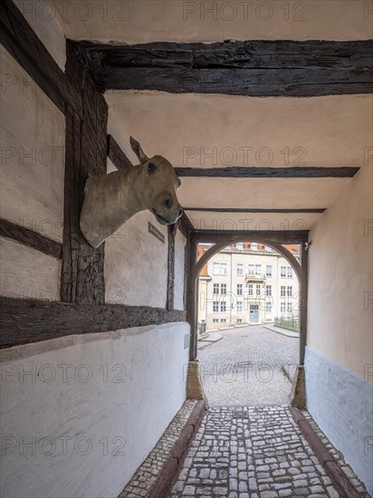 Narrow alley with cobblestones in the historic old town, Schlossgasse, passage through a