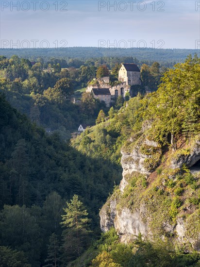 View of the Puettlach valley with rocks, forests and Pottenstein Castle, Franconian Switzerland,