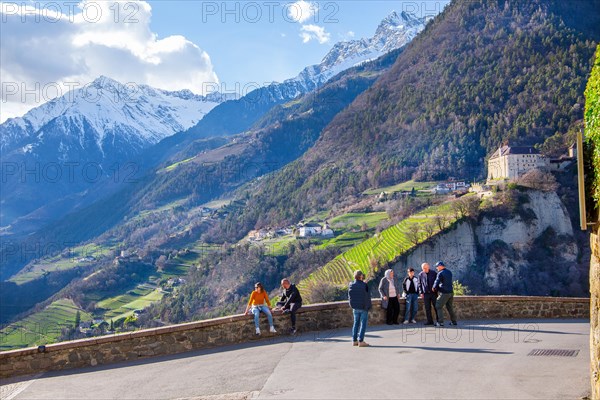Panoramic terrace with castle view in front of the Texel Group with the peak 3006m in spring, Dorf