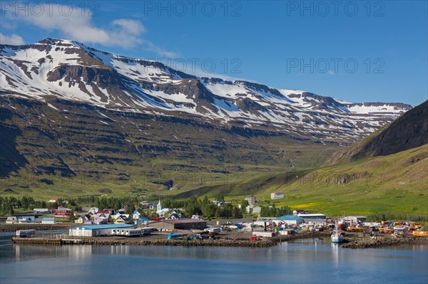 View over harbour and town Seyoisfjoerour along the fjord Seydisfjoerdur in summer, Eastern Region,