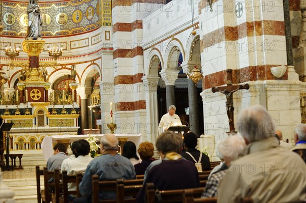 Church of Notre-Dame de la Garde, Marseille, worshippers during a service in a church, Marseille,