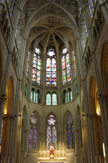 Church of Saint-Vincent-de-Paul, interior view of a church choir with Gothic stained glass windows
