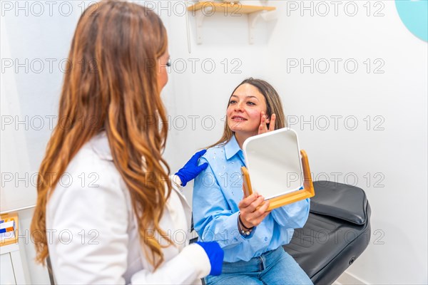 Adult caucasian woman and doctor talking after beauty treatment applying hyaluronic acid injection