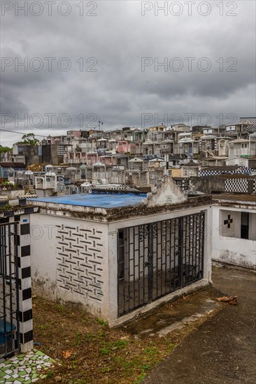 Famous cemetery, many mausoleums or large tombs decorated with tiles, often in black and white.