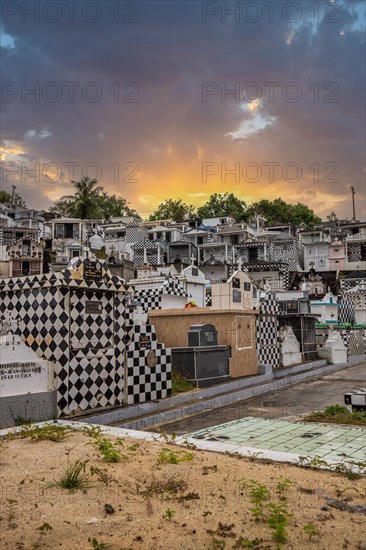 Famous cemetery, many mausoleums or large tombs decorated with tiles, often in black and white.