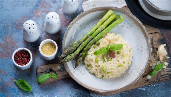 Risotto with asparagus arranged in a plate, surrounded by spices, risotto with green asparagus, KI