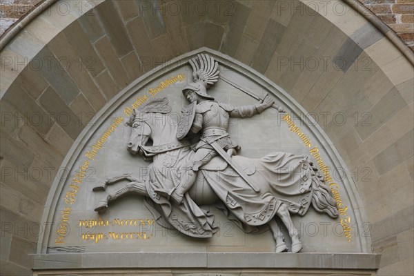 Eagle Gate, stone relief on the outer castle gate, knight figure on horse, armour, inscription,