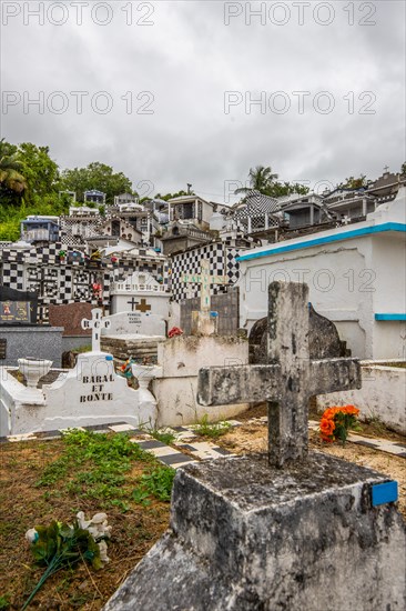 Famous cemetery, many mausoleums or large tombs decorated with tiles, often in black and white.