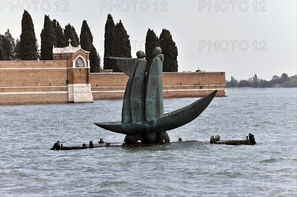 Bronze monument to Dante, 2007, standing in a barge, Virgil points to the cemetery island of San
