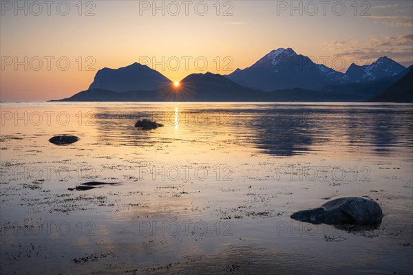 Landscape on the Lofoten Islands. View from Flakstadoya to Vestvagoya with the snow-covered
