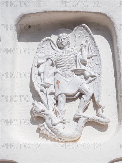 Stone sculpture, St George as dragon slayer, relief on the facade of the Stella Maris church, Porto