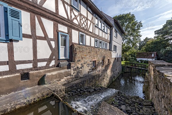 Former mill on the Muehlgraben, historic half-timbered house from around 1709, cultural monument,